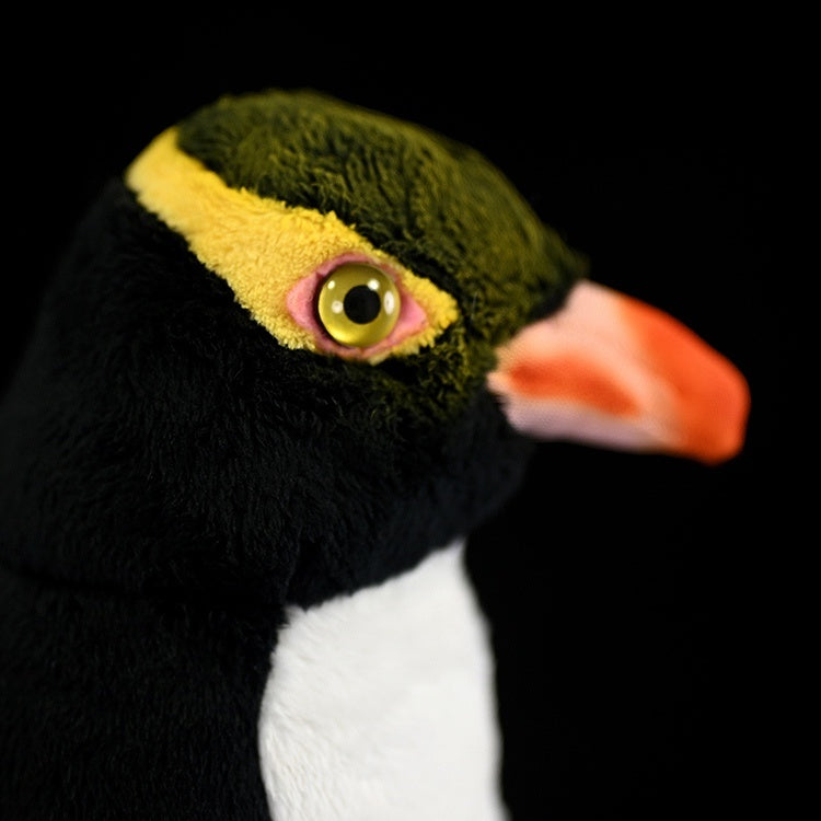 Muñeco de peluche de pingüino de ojos amarillos